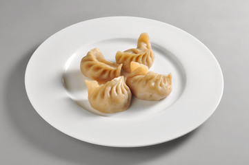 Round dish with Chinese steamed ravioli Jiaozi