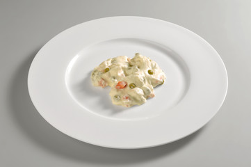 Round dish with Olivier salad