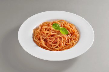 Round dish with a serving of spaghetti with tomato souce