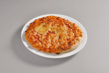 Round dish with baby pizza