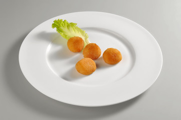 Round dish with mozzarella cheese breaded and fried