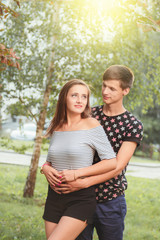 Fototapeta premium boyfriend hugging his girlfriend from behind