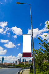 Large blank billboard on a street wall