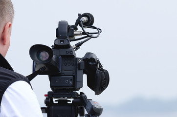 CAMERA - A TV camera on a reporter's stand