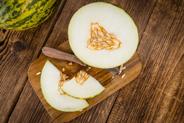 Wooden table with Futuro Melons (selective focus)