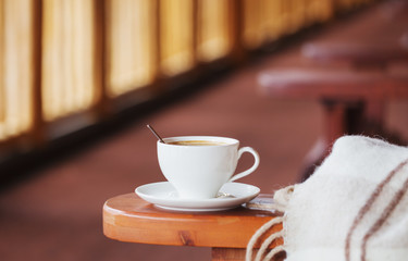 cup of coffee and plaid on terrace