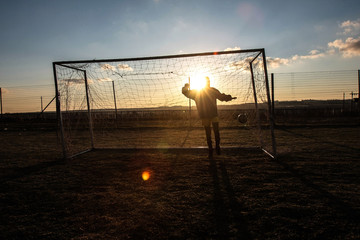 Child in a soccer net in a rural area in South Africa. Picture: DANIEL BORN