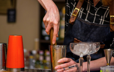 Bartender prepares a cocktail