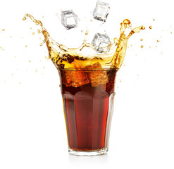 ice cubes falling into a cola drink splashing 
