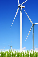 Clean energy source with wind turbine under the clear blue sky