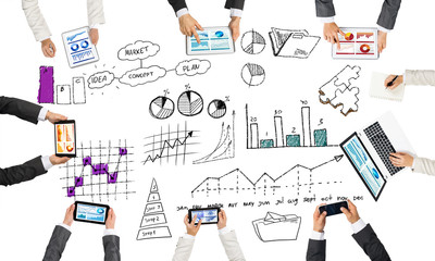 Top view of businesspeople sitting at table and using gadgets