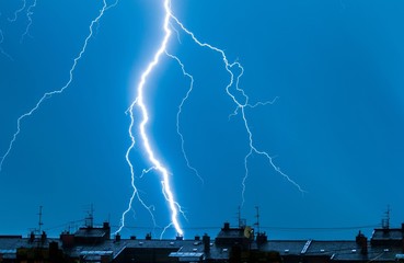 Lightning thunderstorm flash over the city