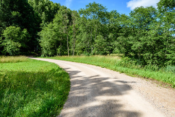 Fototapeta na wymiar gravel road in summer countryside