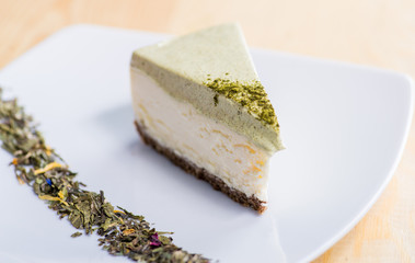 Piece of cheesecake on a plate with a decor