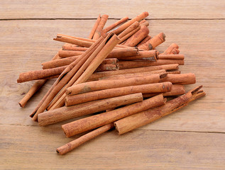 Cinnamon sticks isolated on wood