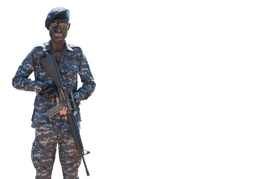 conceptual young soldier face with jungle camouflage paint and automatic rifles in hands isolate on white background.