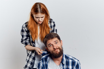 Fototapeta premium Young beautiful woman and guy with beard on white isolated background, repair, building materials, tools