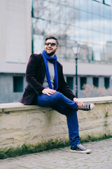 Handsome young man on a walk in town