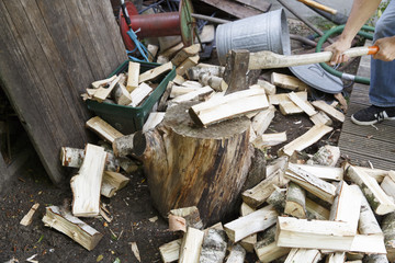 detail of man chopping wood
