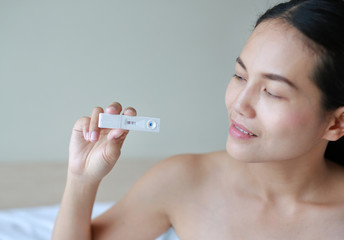 Happy Woman With Pregnancy Test.