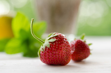 Red sweet strawberry on white table