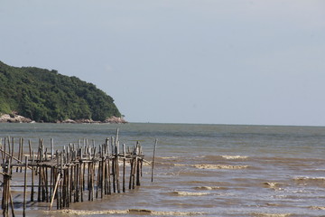 Sea landscape Sky and fishing boats are docked. Evening sun makes a beautiful appearance with reflection.