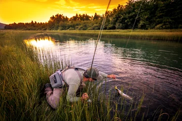 Fotobehang Fly fisherman fishing pike in river © Daniel Vincek