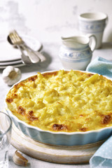 Cauliflower casserole with cheese and milk sauce.