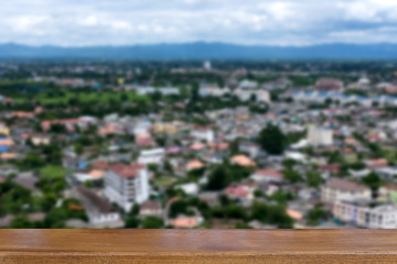 Chiang Mai province in Thailand with surrounding mountains and peaks in summer with wood table for...