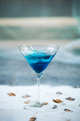 blue cool refreshing summer cocktail drink with ice  in glass