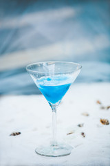 light blue cool refreshing summer cocktail drink with ice