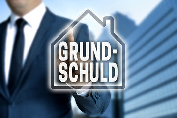 Grundschuld touchscreen wird von Geschäftsmann bedient