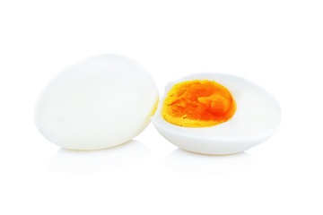 Boiled eggs cut in half isolated on white background.