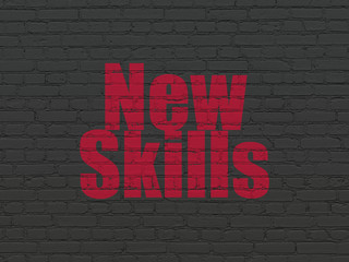 Education concept: New Skills on wall background