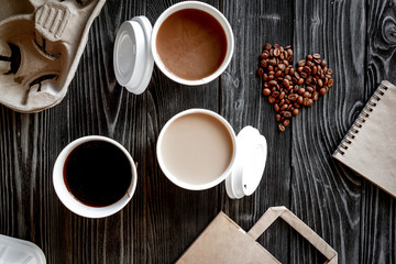 coffee cup take away at wooden background top view