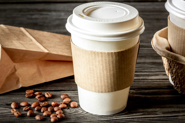 coffee cup to go at wooden background