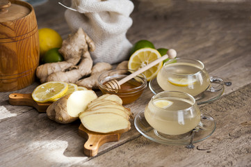 Ginger tea with lemon on a wooden table