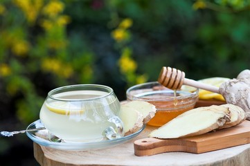 Ginger tea with lemon on a wooden table