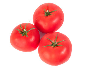 Fresh three tomatoes on a white background
