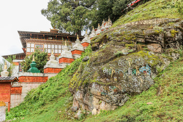 Scripts on a rock at Kurjey Lhakhang (The Temple of Imprints) entrance, Bumthang, Bhutan