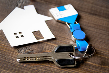 Fototapeta premium concept of buying house on wooden background close up