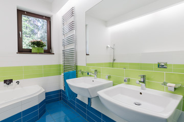 Colourful bathroom with two sinks