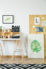 Artist's workspace with wooden furniture