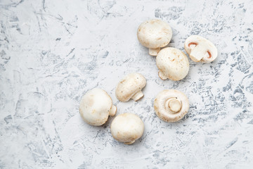 Champignon on a light background. Fresh champignons on a  background