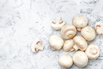 Champignon on a light background. Fresh champignons on a  background
