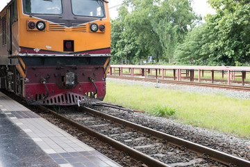 Obraz premium train on railroad ready for departure or just arrival at railway station. travel, trip, journey concept