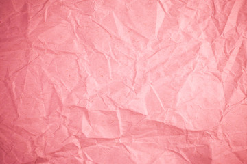 Crumpled recycle pink paper background.