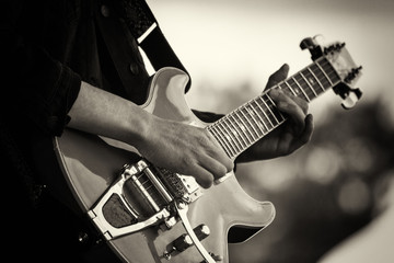 Close up of man playing a guitar - 164287624