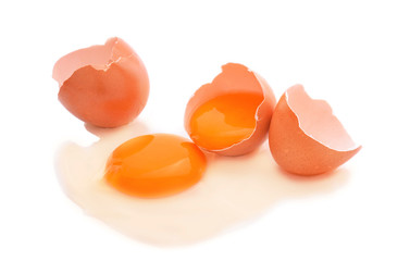 hen eggs and broken eggs on white background