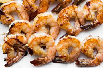 tasty spiced shrimp skewers on a barbecue